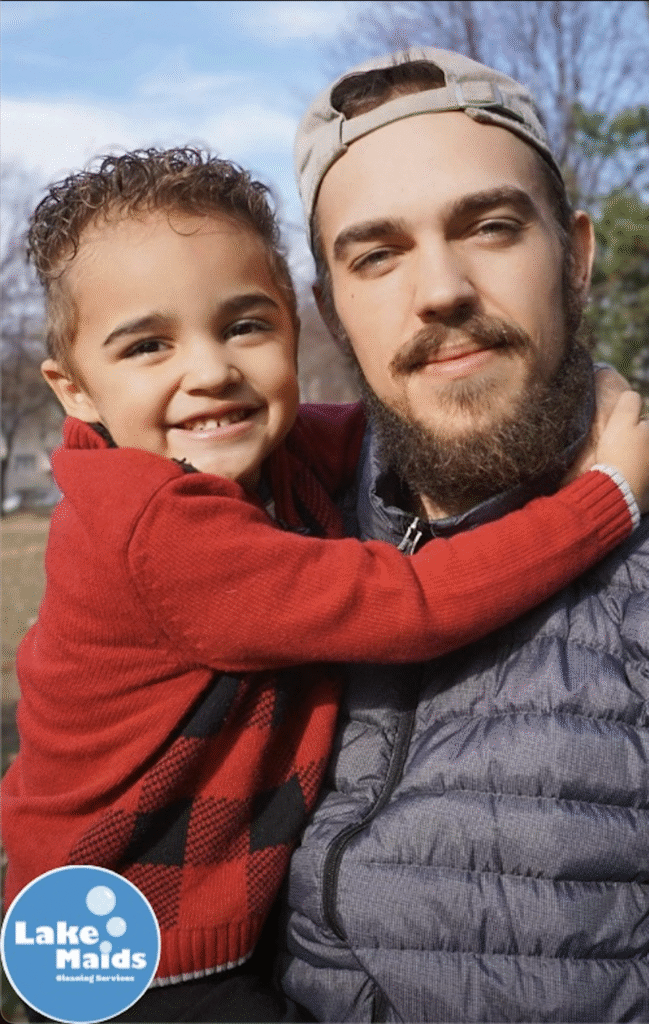 smiling father and son enjoying time outdoors, happy lake maids ownwer